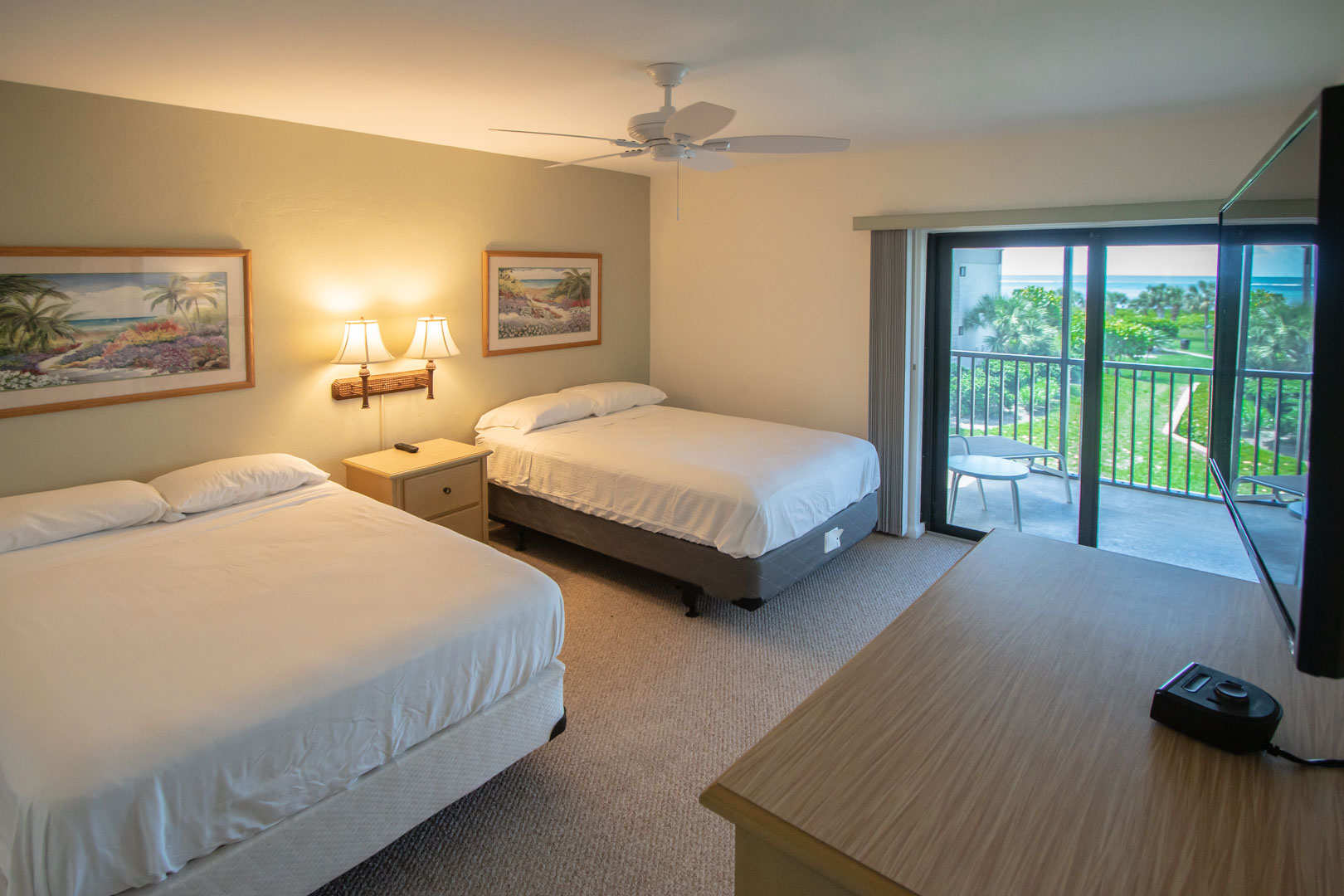 A spacious bedroom with double beds at VRI's Sanibel Beach Club in Sanibel Island, Florida.